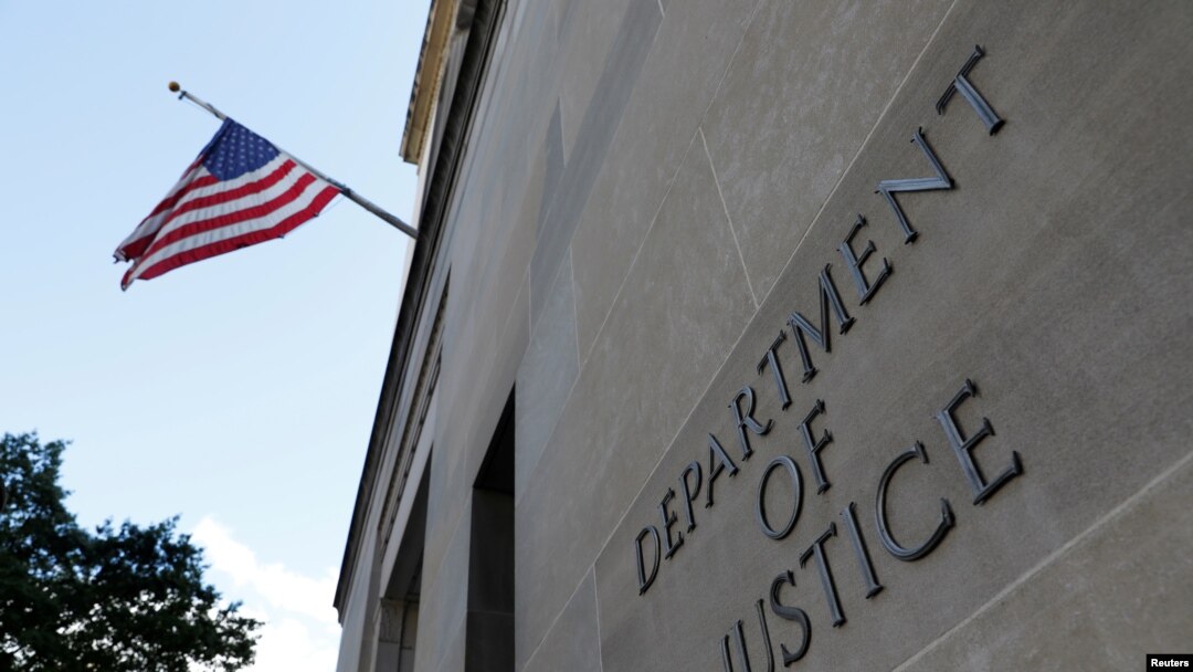 FILE - Signage is seen at the U.S. Department of Justice headquarters in Washington, Aug. 29, 2020. 