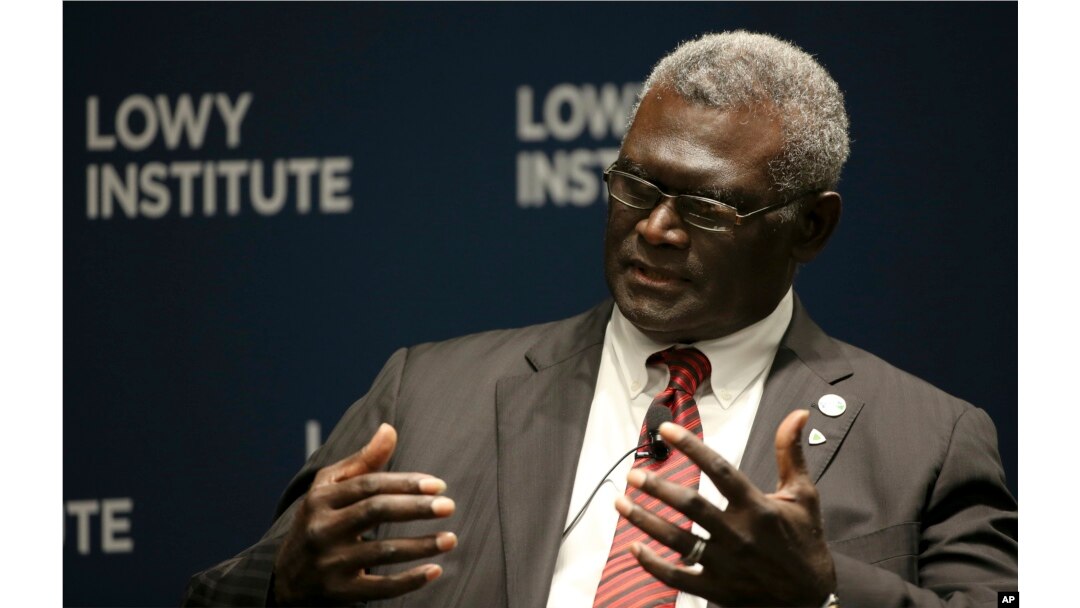Manasseh Damukana Sogavare, Prime Minister of Solomon Islands, attends a Lowy Institute event in Sydney, in August, 2017, (AP Photo/Rick Rycroft)