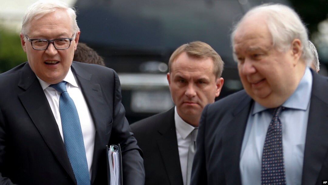 FILE - Russian Deputy Foreign Minister Sergei Ryabkov, left, and then-Russian Ambassador to the U.S. Sergey Kislyak, arrive at the State Department in Washington, July 17, 2017, for talks with Undersecretary of State Thomas Shannon. 