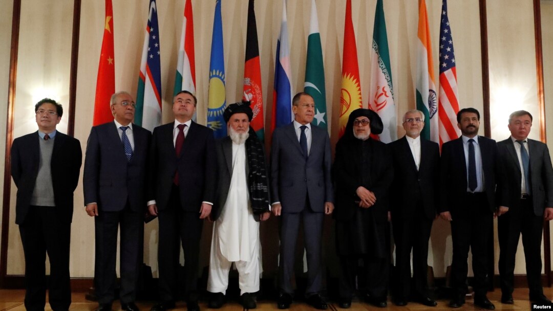 FILE - Russian Foreign Minister Sergey Lavrov (C) poses for a photo with members of delegations during multilateral peace talks on Afghanistan in Moscow, Russia, Nov. 9, 2018. 