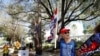 Former U.S. President Donald Trump supporter Kelly Fitzer waves a flag outside of the Conservative Political Action Conference (CPAC) in Orlando, Florida, U.S., Feb. 28, 2021.