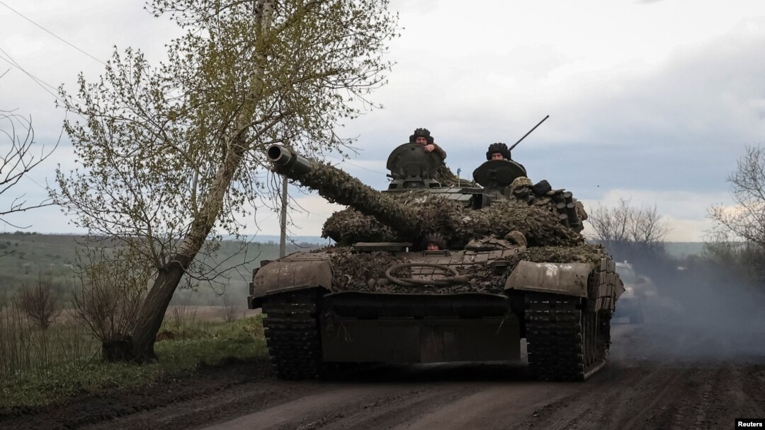 Ukrainian servicemen ride in a tank along a road in the town of Chasiv Yar, amid Russia's attack on Ukraine, near a front line in Donetsk region, Ukraine April 22, 2023. 
