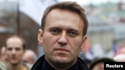 Russian opposition leader Alexei Navalny walks during an opposition rally in Moscow, Oct. 27, 2013.