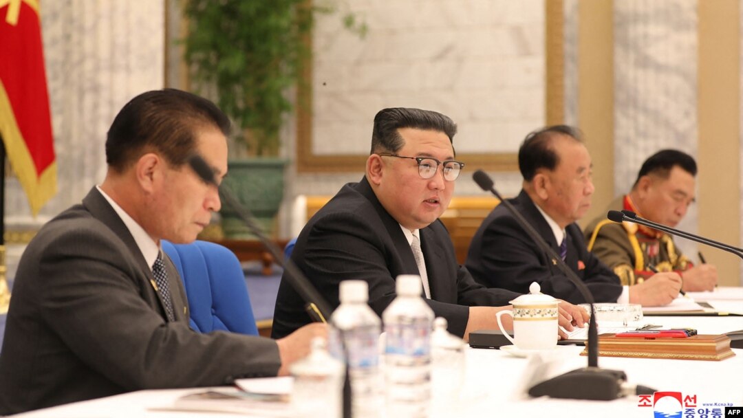 FILE - This undated picture released June 24, 2022, by the Korean Central News Agency shows North Korean leader Kim Jong Un, center, attending a meeting of the Eighth Central Military Commission of the Workers' Party of Korea in Pyongyang.