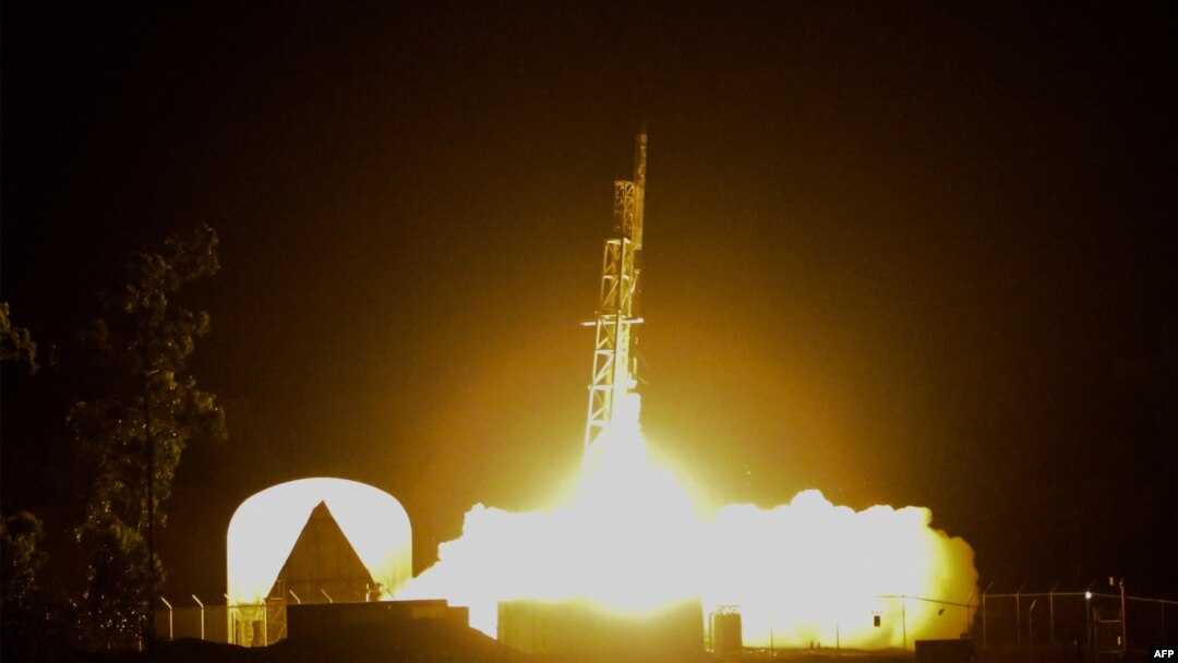This handout image released by NASA shows a rocket, carrying technology likened to a 'mini Hubble' telescope, lifting off from Arnhem Space Center in Australia late on June 26, 2022. (Photo by NASA / AFP) 