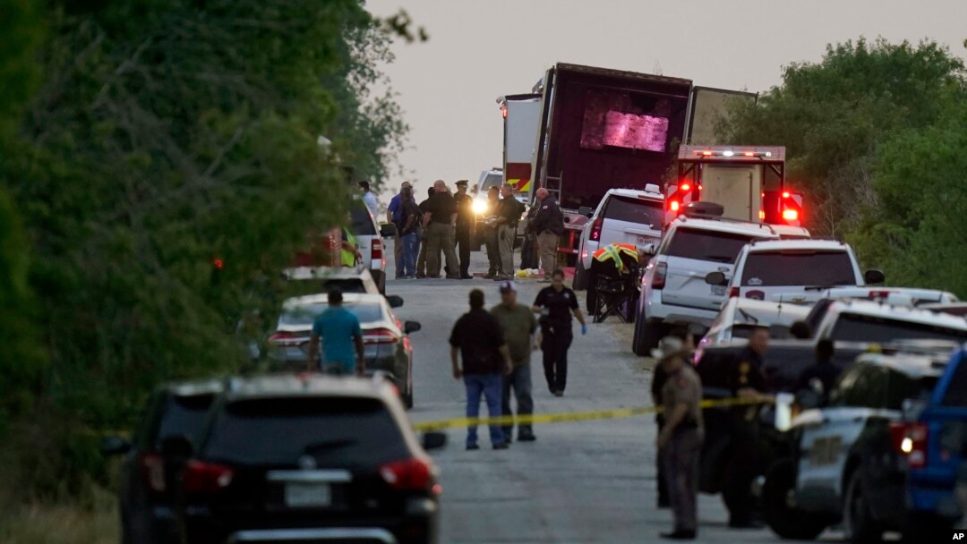 Police and other first responders work the scene where officials say dozens of people have been found dead and others were taken to hospitals with heat-related illnesses after a semitrailer containing suspected migrants was found on June 27, 2022.