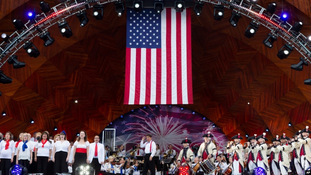 Keith Lockhart, center, conducts during rehearsals for the annual Fourth of July Boston Pops Fireworks Spectacular, July 3, 2022, in Boston, Massachusetts.