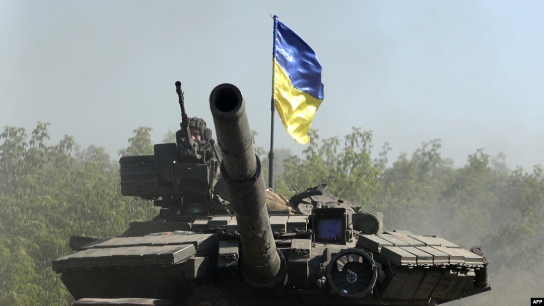 Ukrainian troop ride a tank on a road of the eastern Ukrainian region of Donbas on June 21, 2022, as Ukraine says Russian shelling has caused "catastrophic destruction" in Lysychansk, which lies just across a river from Severodonetsk.