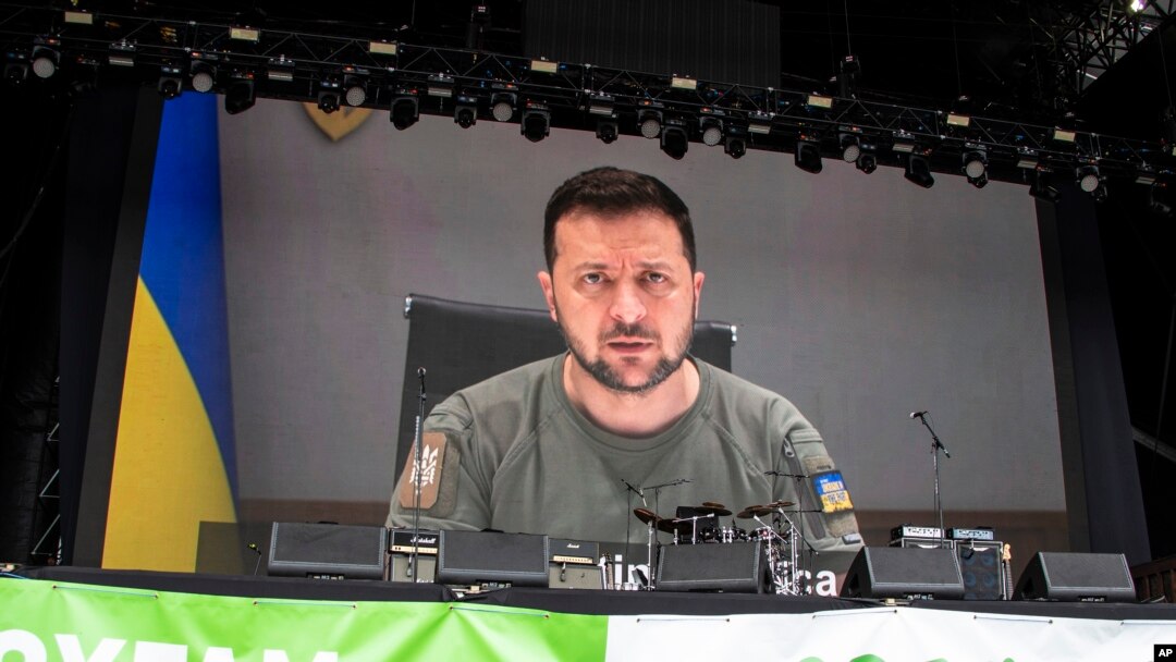 Ukrainian President Volodymyr Zelenskyy speaks via video at the Glastonbury Festival in Worthy Farm, Somerset, England, June 24, 2022.