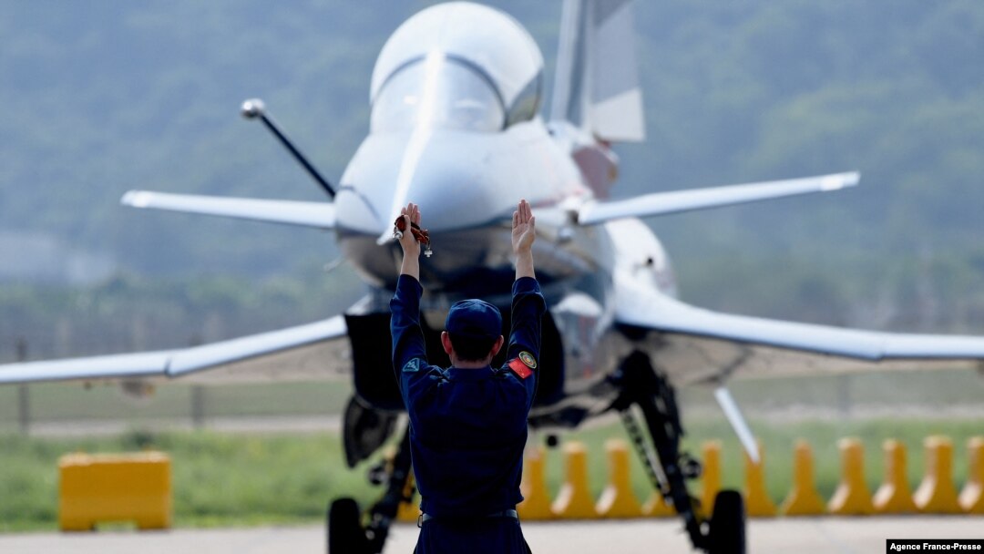 FILE - A Chinese J-10 fighter jet is being guided on the tarmac following a flight demonstration at China's 13th International Aviation and Aerospace Exhibition, in Zhuhai, in southern China's Guangdong province, Sept. 28, 2021. (Photo by Noel Celis / AFP)