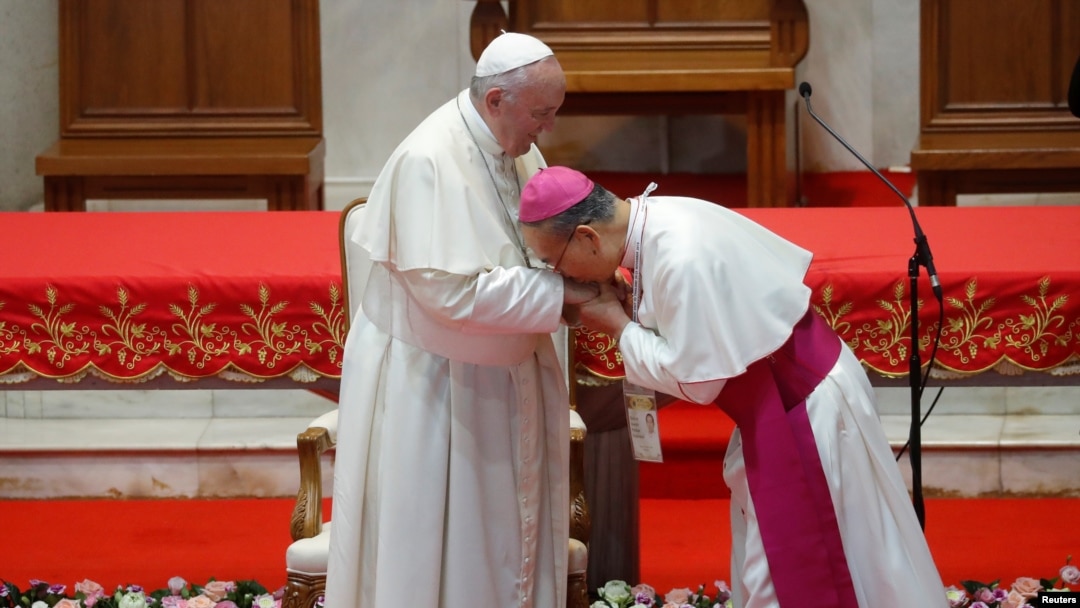 Thai Bishop Joseph Prathan Sridarunsil kisses the hand of Pope Francis during the latter's visit to St. Peter’s Parish church in the Sam Phran district of Nakhon Pathom Province, Thailand, November 22, 2019. REUTERS/Remo Casilli