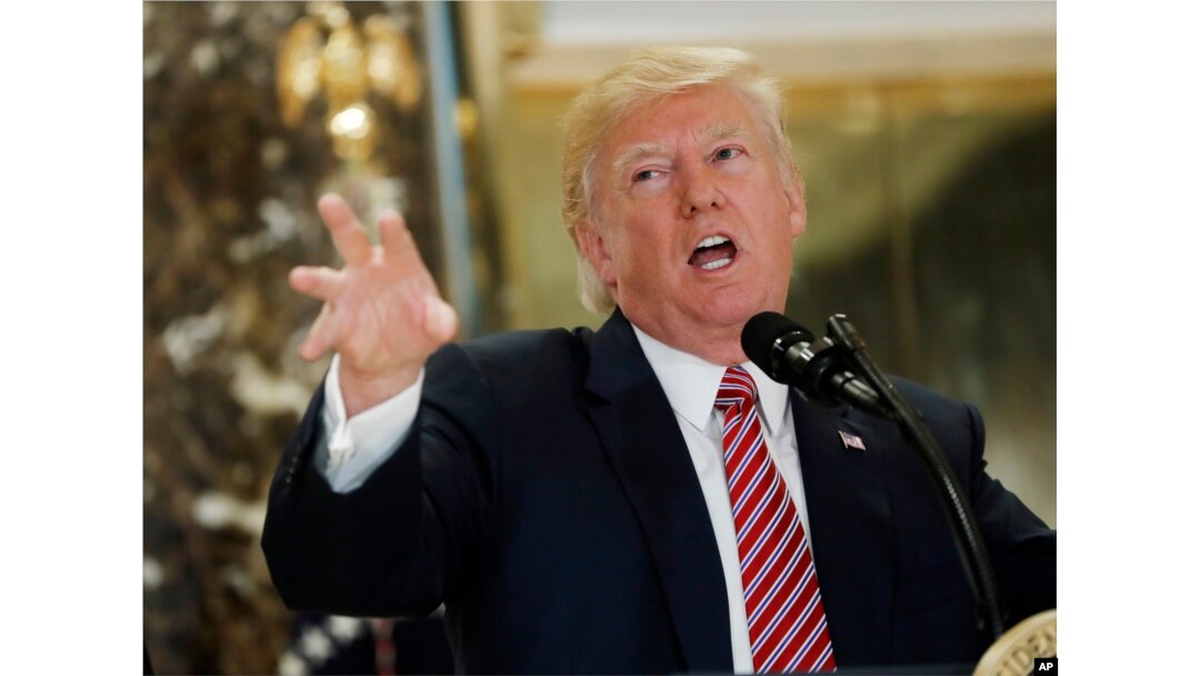 President Donald Trump speaks to the media in the lobby of Trump Tower in New York, Aug. 15, 2017.
