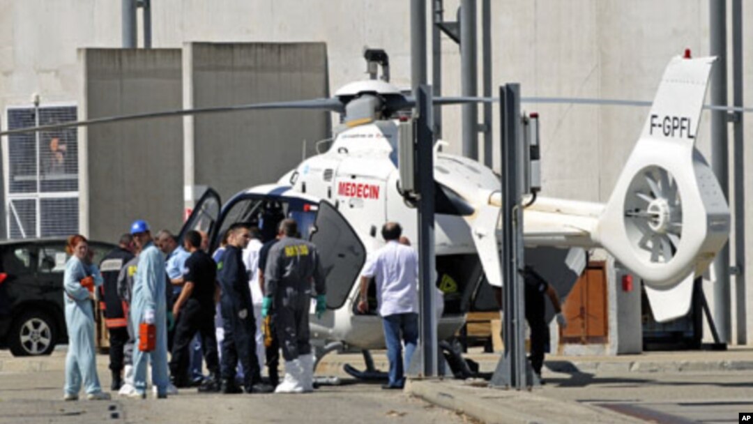 Rescue services evacuate an injured person after an explosion at the Marcoule nuclear waste treatment site killed one person and injured four, southern France, September 12, 2011.
