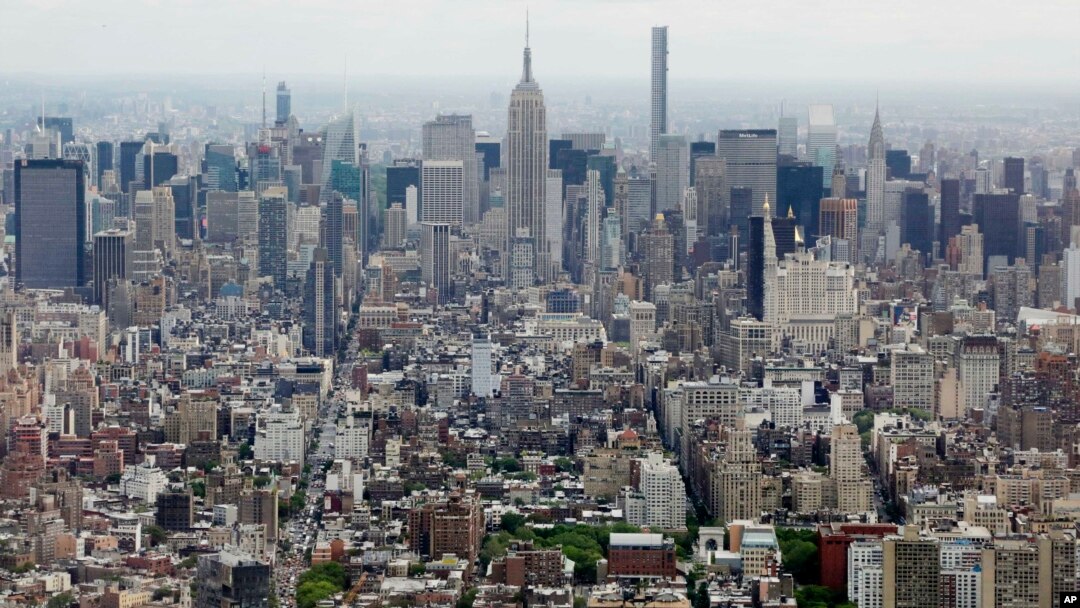 FILE - Midtown Manhattan, including the Empire State Building, center, are seen from the observatory at One World Trade Center in New York, May 20, 2015.