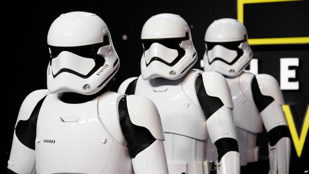 FILE - Actors dressed as Stormtroopers pose for photographers upon arrival at the European premiere of the film 'Star Wars: The Force Awakens ' in London, Dec. 16, 2015.