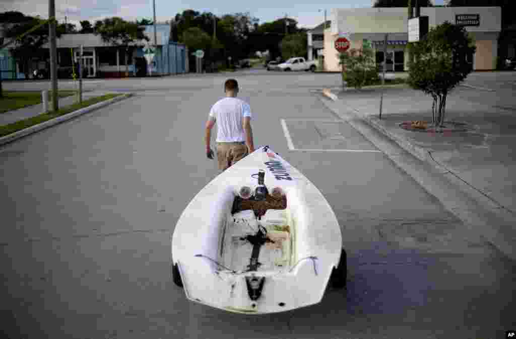 Emmett West pulls his boat from a nearby marina to secure it at his home ahead Hurricane Florence in Morehead City, North Carolina, Sept. 11, 2018.