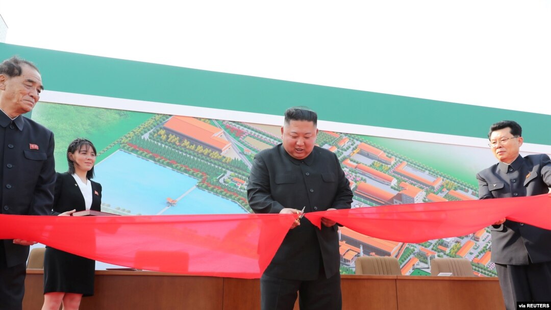 North Korean leader Kim Jong Un attends the completion of a fertilizer plant, together with his younger sister Kim Yo Jong, in a region north of the capital, Pyongyang, in this image released by North Korea's Korean Central News Agency on May 2, 2020.