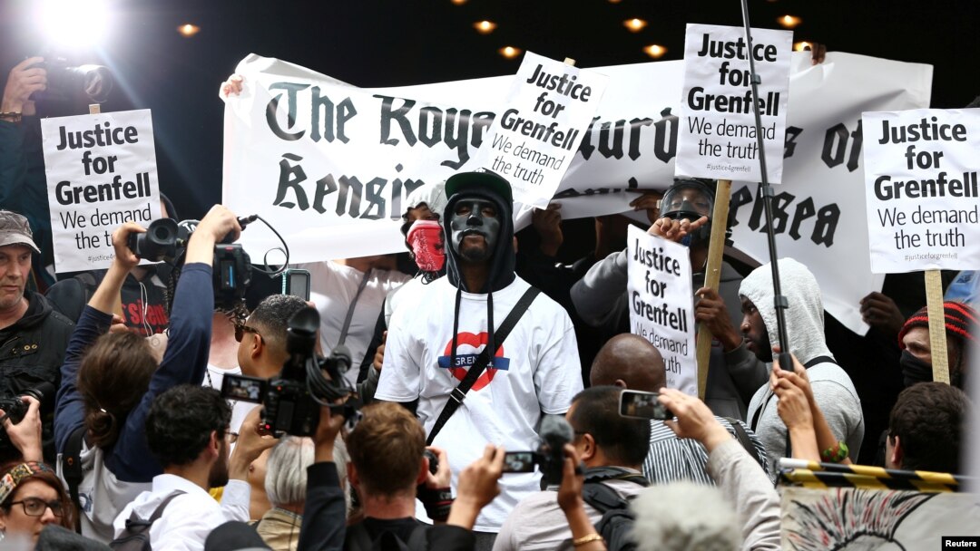Demonstrators protest against what they see as an inadequate response to last month's Grenfell Tower fire, outside a Kensington and Chelsea Council meeting, at Kensington Town Hall in London, Britain, July 19, 2017.