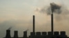 FILE - Smoke rises from the Duvha coal-based power station owned by state power utility Eskom, in Mpumalanga province, South Africa, Feb. 18, 2020. 