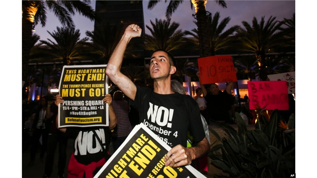Nicholas Maldonado, 23, of San Pedro, protests outside of California Republican Convention in Anaheim, Calf., Oct. 20, 2017. Protesters have gathered outside a Southern California hotel where former White House adviser Steve Bannon gave the keynote speech at a state Republican convention.