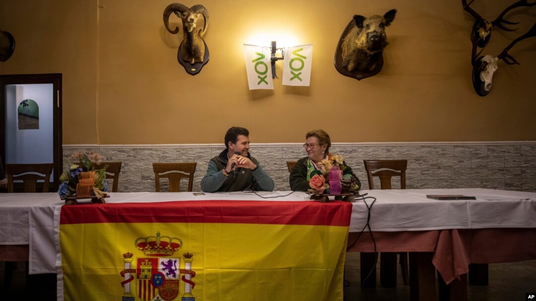 Vox's Ciudad Real provincial candidate Ricardo Chamorro, left, and Toyan Patón during a meeting with local farmers at a bar in Brazatortas, on the edge of the Alcudia valley, central Spainو April 10, 2019.