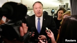 FILE - U.S. Secretary of State Mike Pompeo speaks to reporters in flight after a visit to Baghdad, Iraq, May 8, 2019.