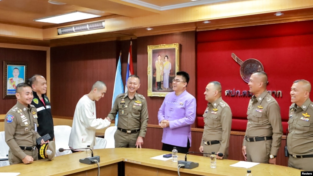 Chinese actor Wang Xing shakes hands with a Thai police officer after being returned to Thailand Jan. 7, 2025. He had been kidnapped and forced to work in a telecom fraud center in Myanmar. Royal Thai Police/Handout via REUTERS