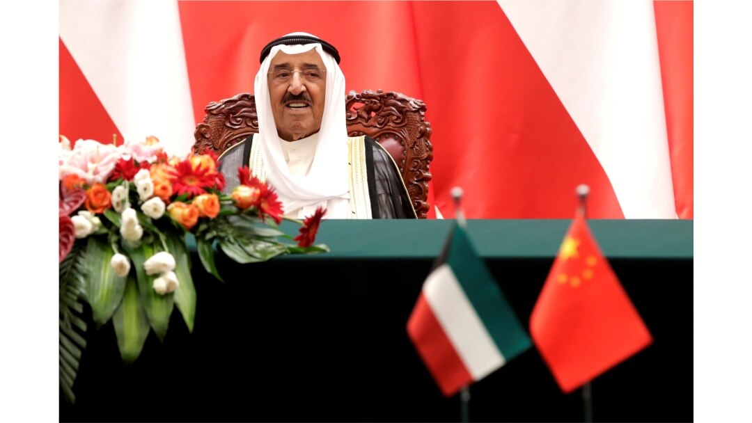 FILE - Kuwait's Emir Sheikh Sabah al-Ahmad al-Jaber al-Sabah looks as he witnesses a signing ceremony with Chinese President Xi Jinping at the Great Hall of the People in Beijing.