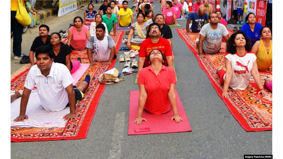 A yoga class being held in Gurgaon, near New Delhi is one of hundreds of such sessions which are gaining in popularity in India.