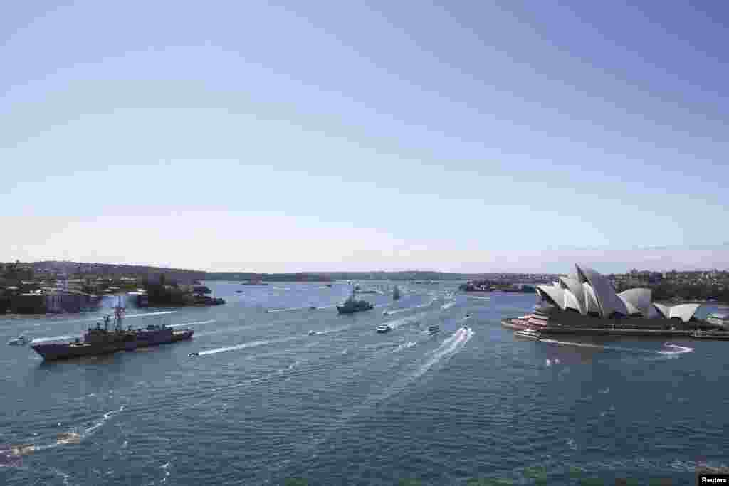 Royal Australian Navy warships led by HMAS Sydney enter Sydney Harbor as part of the International Fleet Review celebrations, Oct. 4, 2013.
