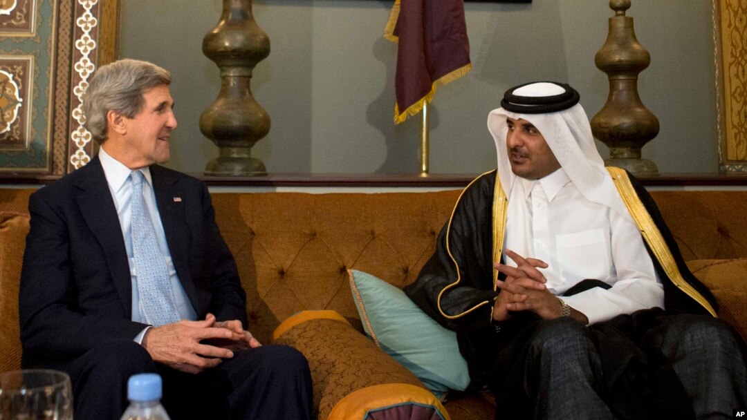 FILE - U.S. Secretary of State John Kerry meets with the Emir of Qatar Sheik Tamim bin Hamad Al Thani.