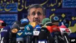 Former President Mahmoud Ahmadinejad speaks with the media after registering his name as a candidate for the June 18 presidential elections at elections headquarters of the Interior Ministry in Tehran, Iran, May 12, 2021. 