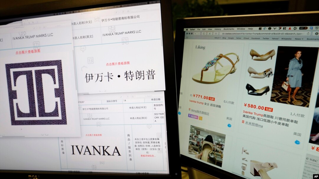 FILE - Images of trademark applications from Ivanka Trump Marks LLC, taken off the website of China's trademark database, are displayed next to a Chinese online shopping website selling purported Ivanka Trump branded footwear on computer screens in Beijing, China, April 21, 2017.
