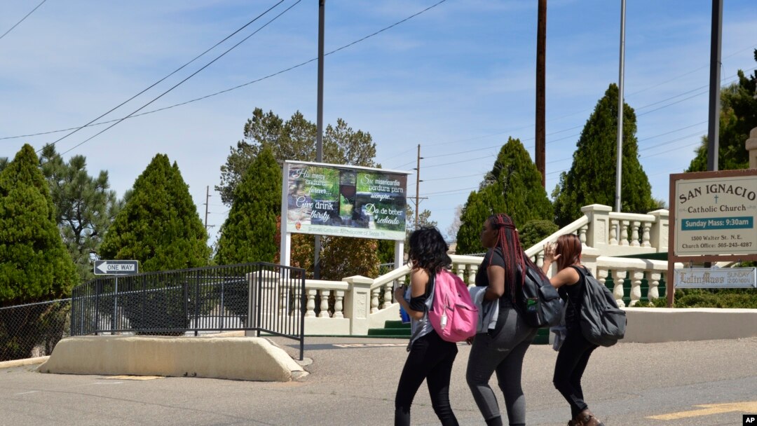 Students from Albuquerque High School walk through Martineztown, one of Albuquerque's oldest and most historic neighborhoods, April 11, 2018. The ACLU of New Mexico is seeking to extend protections to students against discrimination.