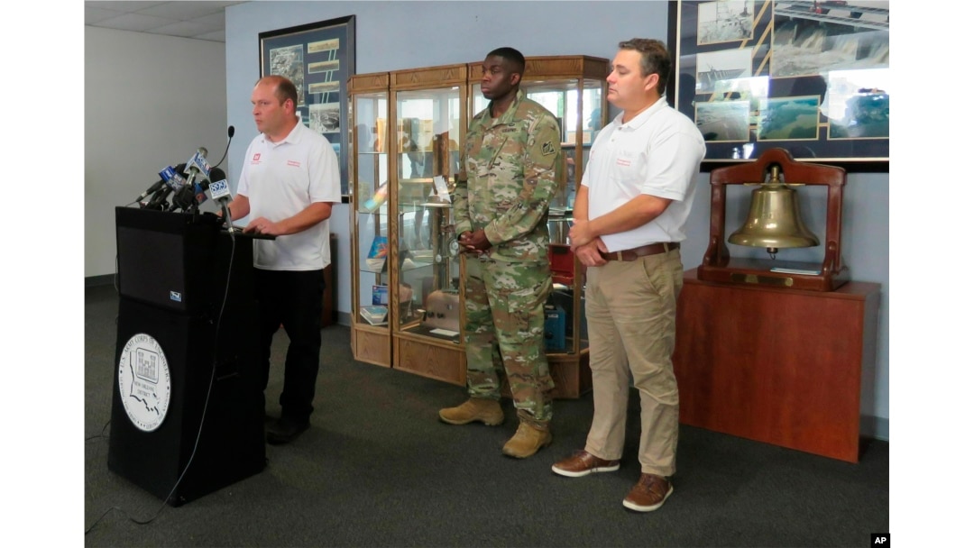 Heath Jones, chief of emergency management for the Army Corps of New Orleans New Orleans District, talks to reporters at the agency's offices, May 9, 2019, about plans to reopen the Bonnet Carr Spillway to relieve stress on the levees at New Orleans. Behind him are Maj. Jordon Davis, deputy commander of the district, and David Ramirez, chief of water management.