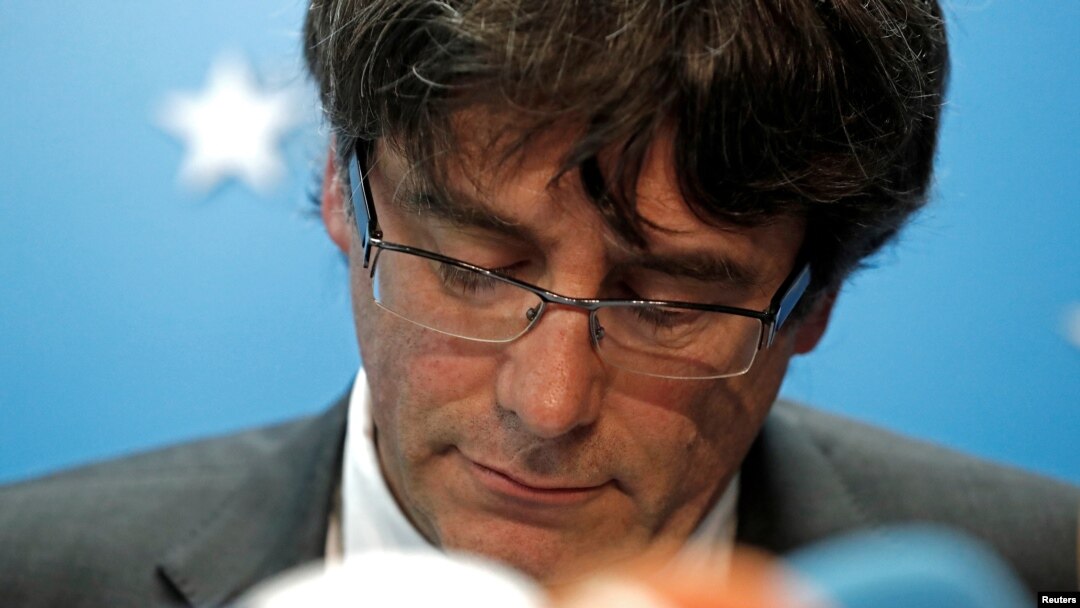 FILE - Sacked Catalan leader Carles Puigdemont attends a news conference at the Press Club Brussels Europe in Brussels, Belgium, Oct. 31, 2017.