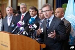 FILE - U.N. representative for Libya, Bernardino Leon, right, addresses reporters while Libyan parliament members listen in Rabat, Morocco, Sept. 18, 2015.