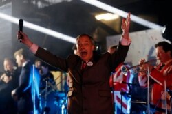 Brexit Party leader Nigel Farage celebrates during a rally in London, Friday, Jan. 31, 2020.
