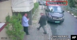 FILE - This image taken from CCTV video obtained by the Turkish newspaper Hurriyet and made available on Oct. 9, 2018 claims to show Saudi journalist Jamal Khashoggi entering the Saudi consulate in Istanbul, Oct. 2, 2018.