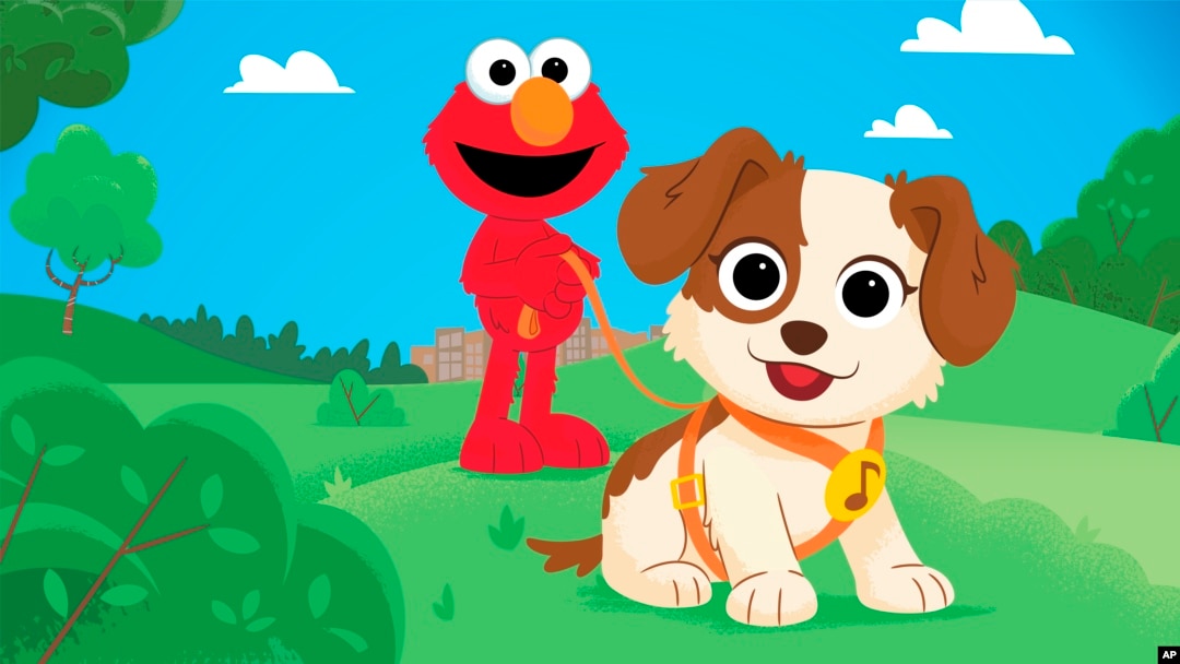 In this image provided by Sesame Workshop, Elmo and his new dog Tango are seen in an upcoming special show "Furry Friends Forever: Elmo Gets a Puppy," which will air on HBO Max on August 5. (Sesame Workshop vía AP) 