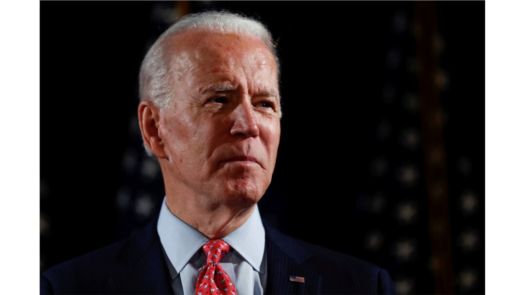 FILE PHOTO: Democratic U.S. presidential candidate and former Vice President Joe Biden speaks about responses to the COVID-19 coronavirus pandemic at an event in Wilmington, Delaware, U.S., March 12, 2020.