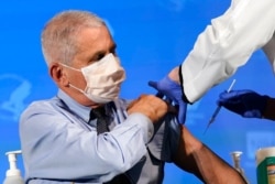 Dr. Anthony Fauci, director of the National Institute of Allergy and Infectious Diseases, prepares to receive his first dose of the COVID-19 vaccine at the National Institutes of Health, in Bethesda, Md., Dec. 22, 2020.