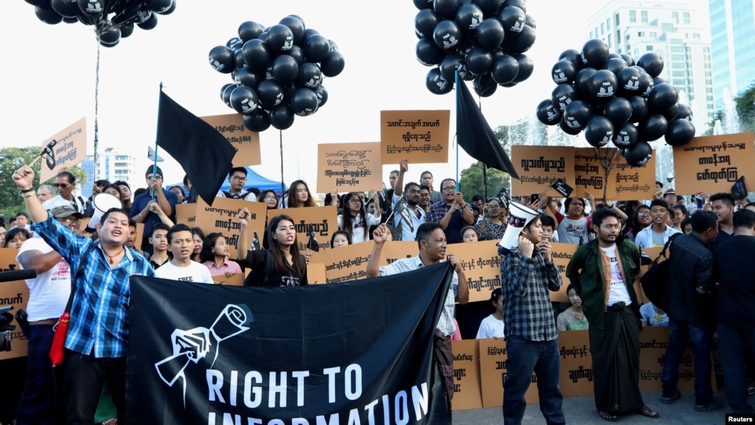 FILE - Myanmar press freedom advocates and youth activists hold a demonstration demanding the freedom of two jailed Reuters journalists Wa Lone and Kyaw Soe Oo in Yangon, Myanmar, Sept. 16, 2018. 