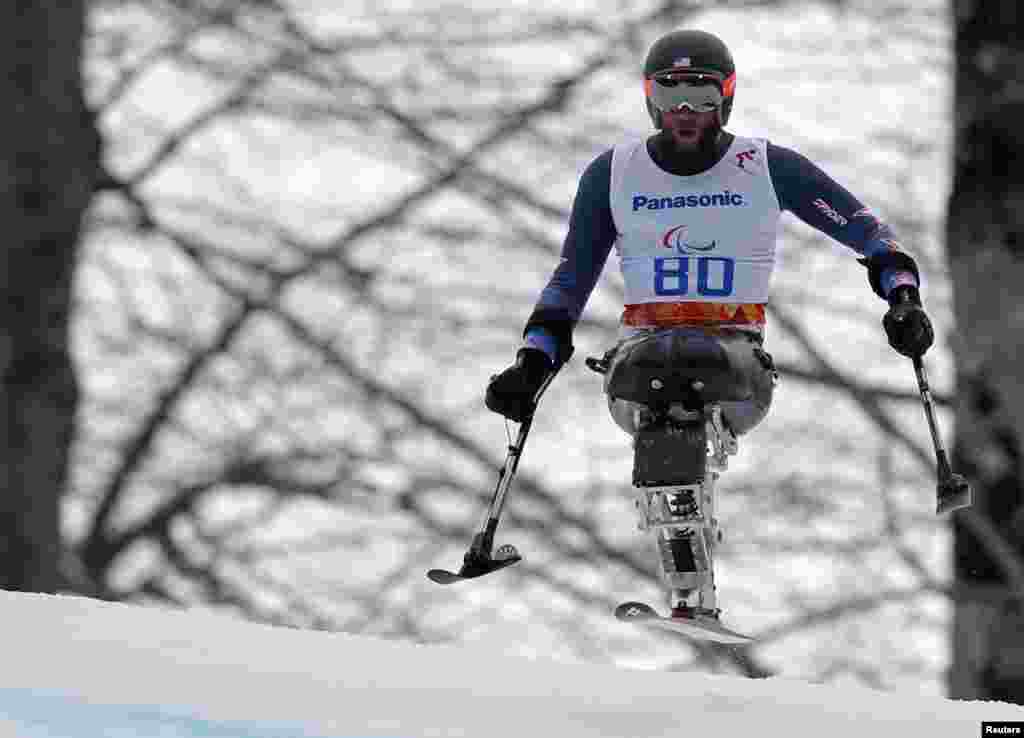 Heath Calhoun of the U.S. skis during the men's alpine skiing Super-G sitting event of the Super combined at the 2014 Sochi Paralympic Winter Games at the Rosa Khutor Alpine Center, Russia.