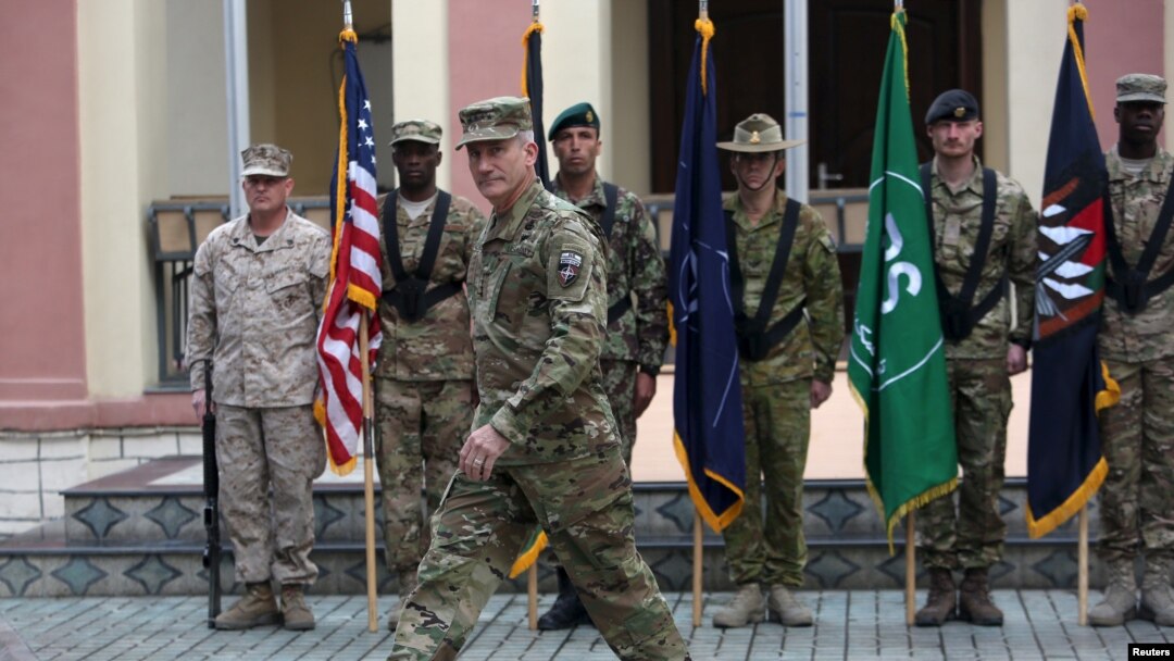 FILE - Commander of NATO Resolute Support forces and United States forces in Afghanistan, U.S. Army General John Nicholson walks during a change of command ceremony in Resolute Support headquarters in Kabul, Afghanistan, March 2, 2016.