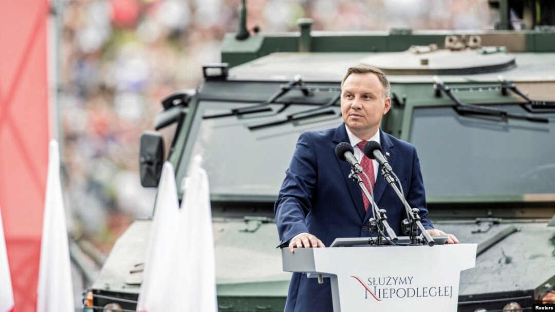 FILE - Poland's President Andrzej Duda speaks as he attends the Polish National Army Day parade in Warsaw, Poland, Aug. 15, 2018.