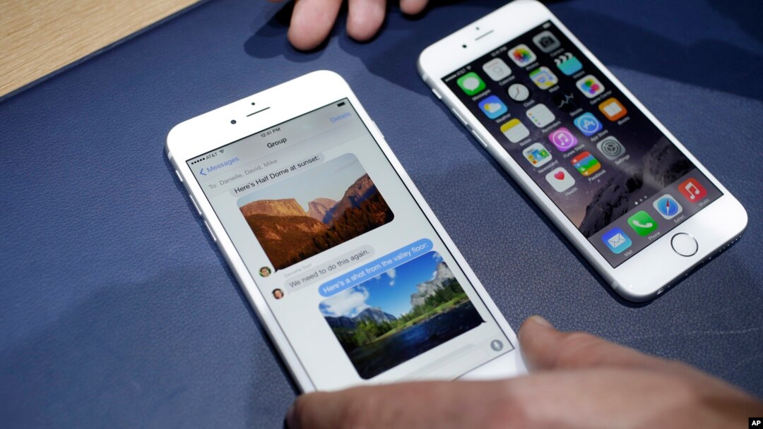 FILE - In this Tuesday, Sept. 9, 2014, file photo, the iPhone 6 plus, left, and iPhone 6 are displayed, in Cupertino, Calif. 