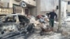 Residents clean up the rubble and start to rebuild in the days after Iraqi forces retook their neighborhood in Mosul, Iraq, March 2, 2017. (H. Murdock/VOA)