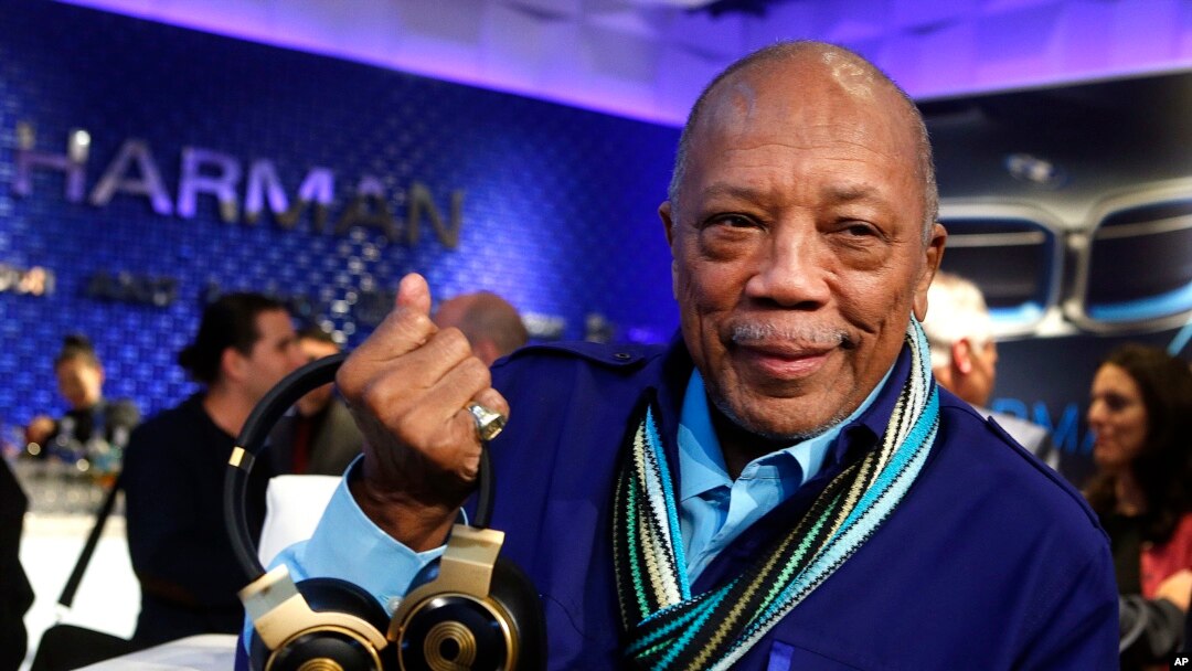 FILE - Quincy Jones unveils his new N90Q headphones from AKG, the world's first headphones with personalized sound, at the HARMAN flagship store in New York.
