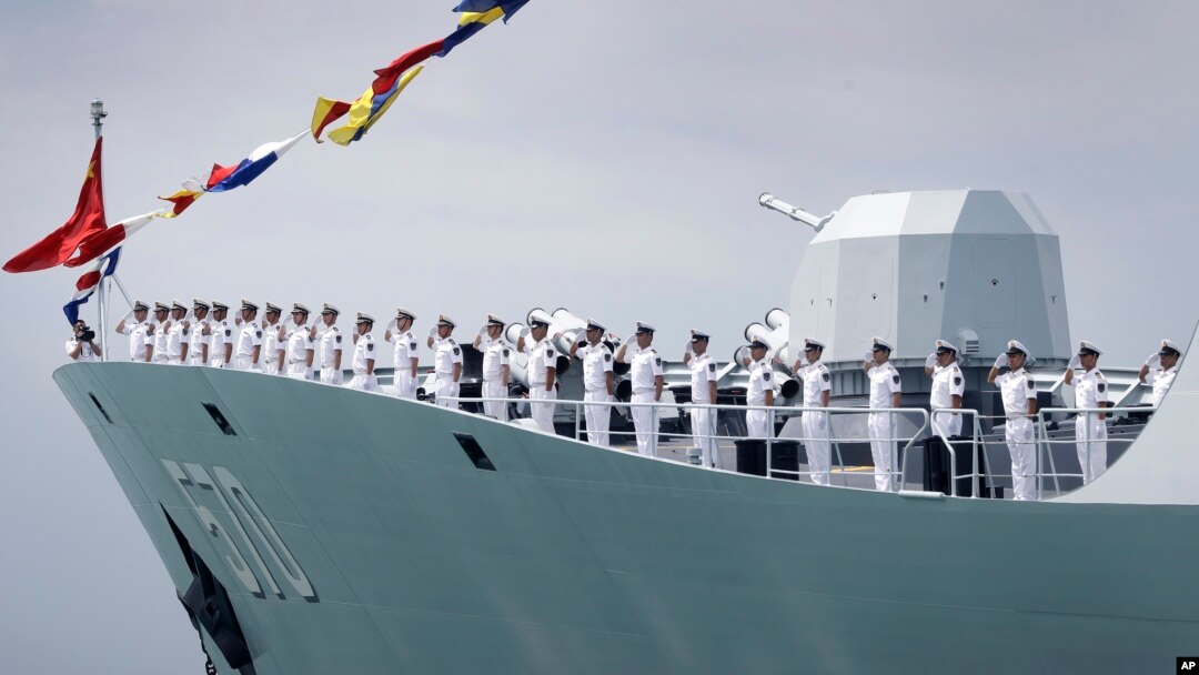 FILE - China's frigate Huangshan is seen anchored in the waters off RSS Singapura Changi Naval Base, May 15, 2017, in Singapore. 